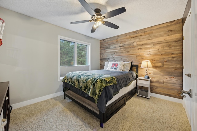 26659 145th St NW, Zimmerman, MN 55398 - bedroom featuring carpet flooring, wood walls, a ceiling fan, and a textured ceiling