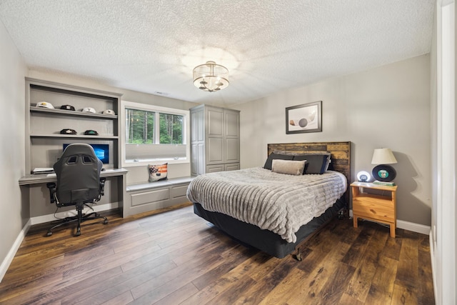 26659 145th St NW, Zimmerman, MN 55398 - bedroom featuring a textured ceiling, a chandelier, wood finished floors, and a desk