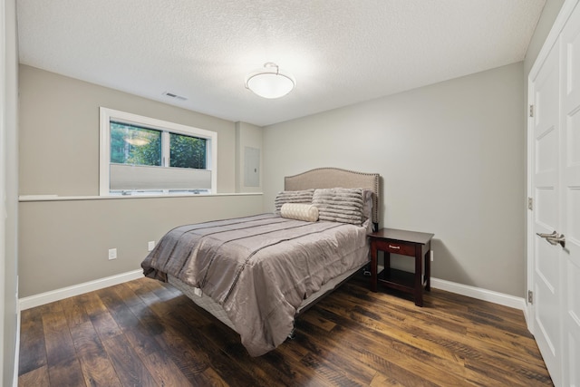 26659 145th St NW, Zimmerman, MN 55398 - bedroom featuring wood finished floors and a textured ceiling