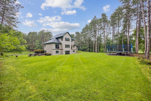 26659 145th St NW, Zimmerman, MN 55398 - view of green lawn with a trampoline