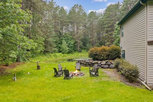 26659 145th St NW, Zimmerman, MN 55398 - view of green lawn with a fire pit