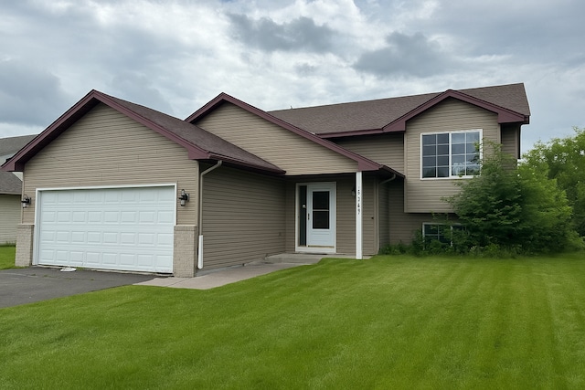 17567 305th Ln, Shafer, MN 55074 - tri-level home with an attached garage, asphalt driveway, a front lawn, and roof with shingles