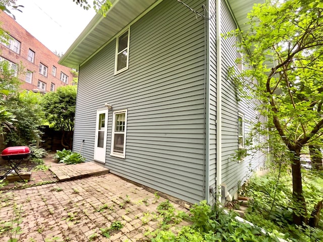 2411 Como Ave, Saint Paul, MN 55108 - view of side of home with a patio