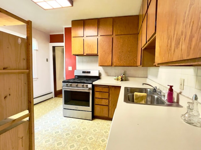 2411 Como Ave, Saint Paul, MN 55108 - kitchen featuring stainless steel range with gas stovetop, baseboard heating, decorative backsplash, brown cabinets, and light countertops