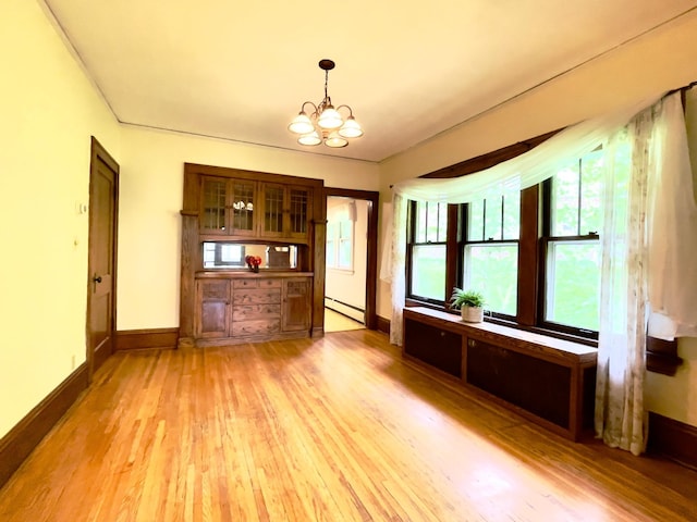 2411 Como Ave, Saint Paul, MN 55108 - unfurnished living room with a baseboard heating unit, light wood finished floors, and a chandelier