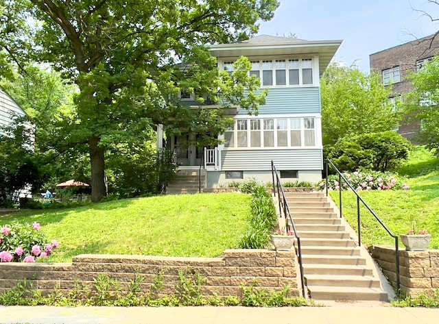 2411 Como Ave, Saint Paul, MN 55108 - view of front facade featuring stairway and a front yard