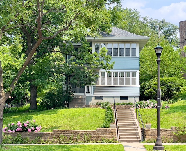 2411 Como Ave, Saint Paul, MN 55108 - view of front of property featuring stairs, a front lawn, and a shingled roof
