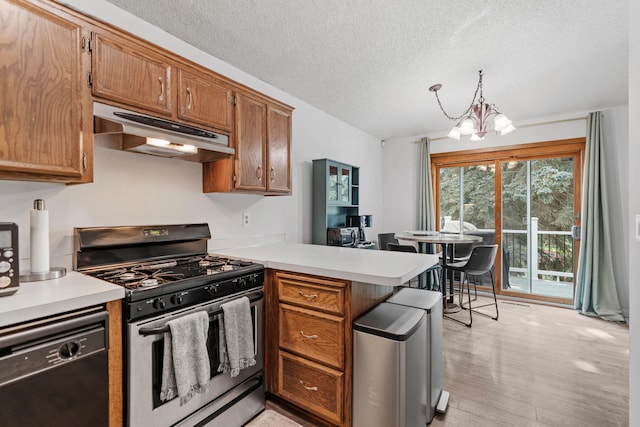 14258 Towers Ln, Eden Prairie, MN 55347 - kitchen featuring stainless steel range with gas stovetop, under cabinet range hood, dishwasher, a peninsula, and a chandelier