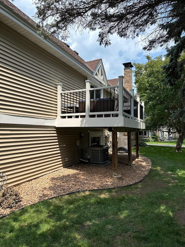 14258 Towers Ln, Eden Prairie, MN 55347 - back of house featuring a yard, a chimney, and a wooden deck