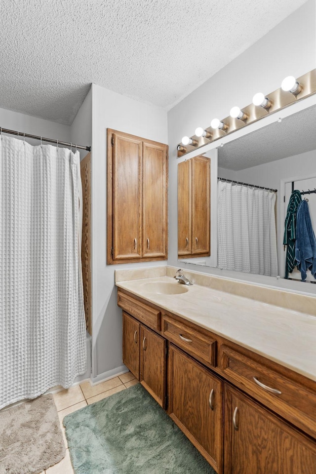14258 Towers Ln, Eden Prairie, MN 55347 - bathroom with vanity, a textured ceiling, tile patterned floors, and shower / bathtub combination with curtain