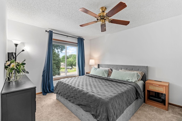 14258 Towers Ln, Eden Prairie, MN 55347 - bedroom with light carpet, a textured ceiling, and ceiling fan