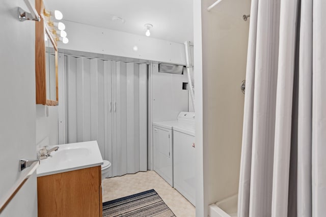 14258 Towers Ln, Eden Prairie, MN 55347 - full bathroom featuring vanity, independent washer and dryer, a shower with shower curtain, and tile patterned floors