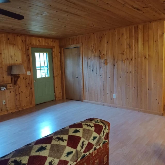 1951 Wolf Lake Dr SE, Bemidji, MN 56601 - foyer with wooden ceiling, wood finished floors, and wooden walls