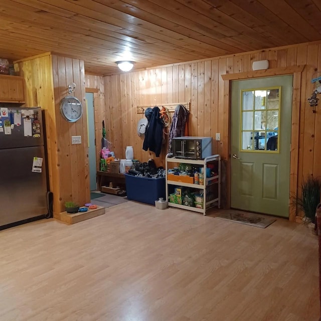 1951 Wolf Lake Dr SE, Bemidji, MN 56601 - entrance foyer with wooden walls, wood ceiling, and wood finished floors