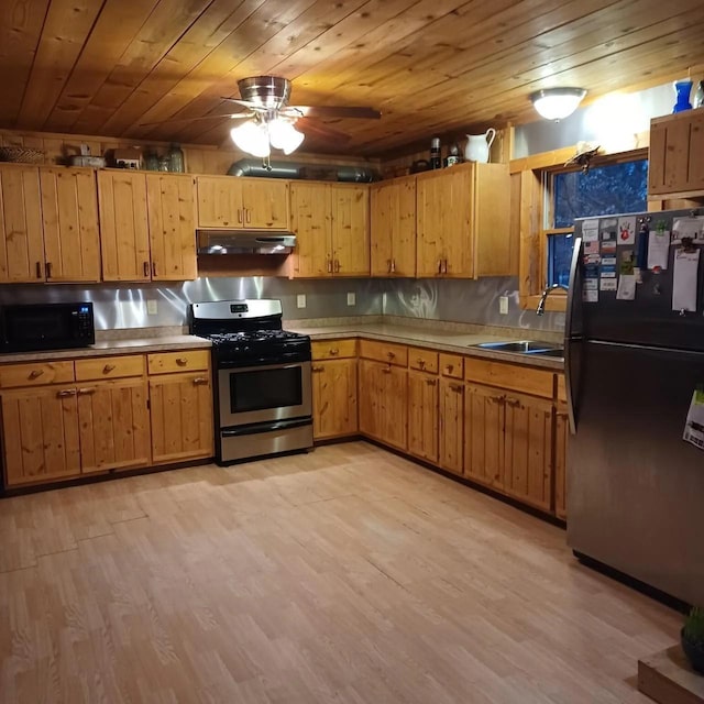 1951 Wolf Lake Dr SE, Bemidji, MN 56601 - kitchen with black appliances, under cabinet range hood, wood ceiling, ceiling fan, and light wood-style flooring