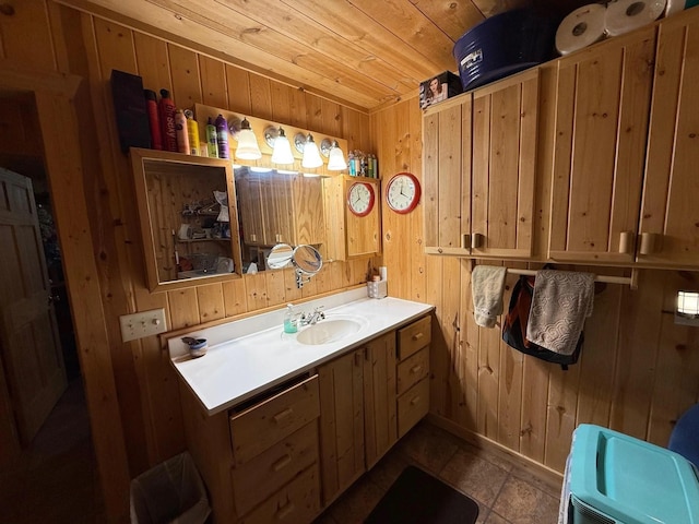1951 Wolf Lake Dr SE, Bemidji, MN 56601 - bathroom featuring wood walls, vanity, and wooden ceiling