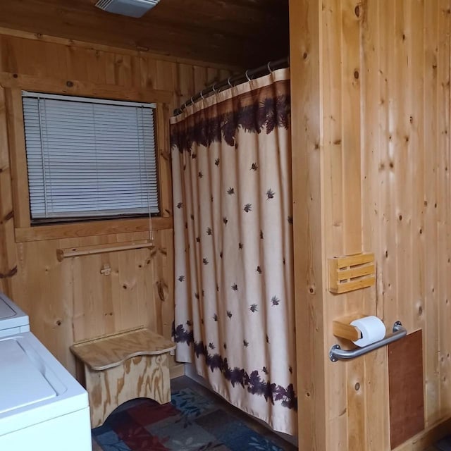 1951 Wolf Lake Dr SE, Bemidji, MN 56601 - full bathroom with wooden walls, washer / clothes dryer, a shower with curtain, and wooden ceiling