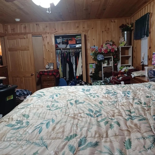1951 Wolf Lake Dr SE, Bemidji, MN 56601 - bedroom with wooden ceiling, a closet, and wooden walls