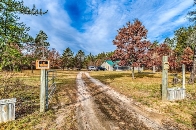 1951 Wolf Lake Dr SE, Bemidji, MN 56601 - view of dirt / gravel road featuring a gated entry