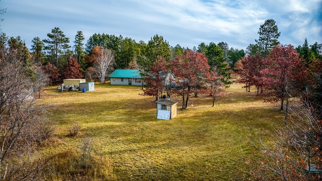 1951 Wolf Lake Dr SE, Bemidji, MN 56601 - view of green lawn with a storage shed