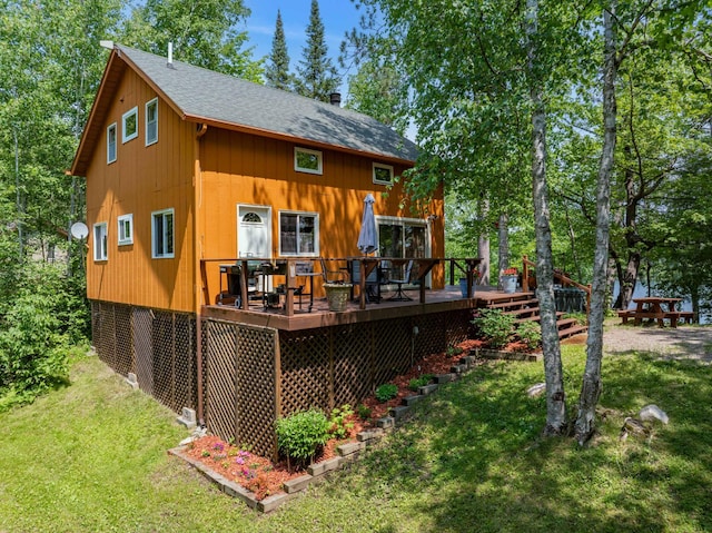 43784 Spider Lake Rd, Marcell, MN 56657 - back of house with a lawn, a deck, and a shingled roof