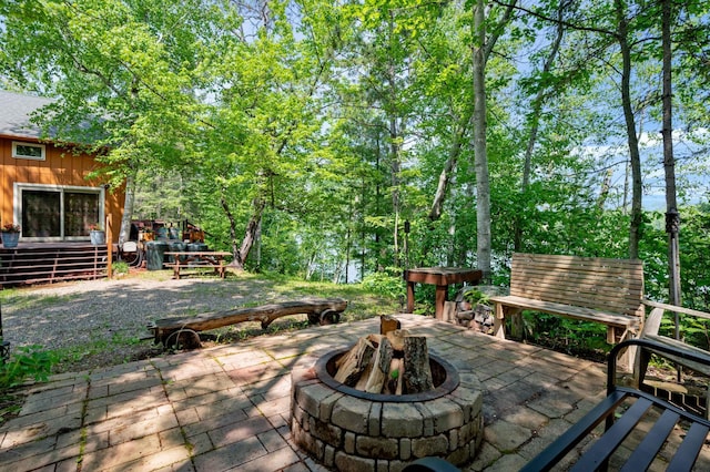 43784 Spider Lake Rd, Marcell, MN 56657 - wooden terrace with a fire pit and a patio