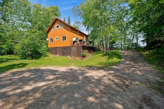 43784 Spider Lake Rd, Marcell, MN 56657 - view of property exterior with a wooden deck and a lawn