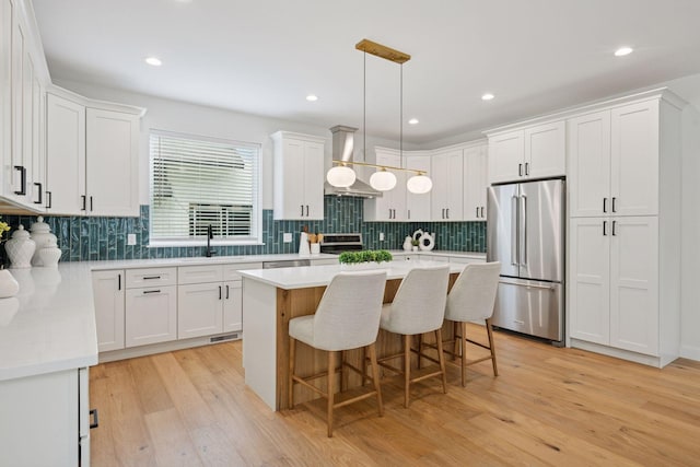 5043 42nd Ave S, Minneapolis, MN 55417 - kitchen featuring high quality fridge, light countertops, white cabinetry, and recessed lighting