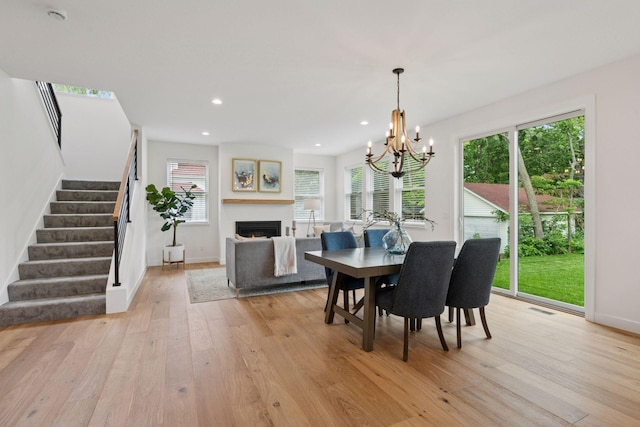 5043 42nd Ave S, Minneapolis, MN 55417 - dining room with stairway, light wood finished floors, a chandelier, healthy amount of natural light, and recessed lighting