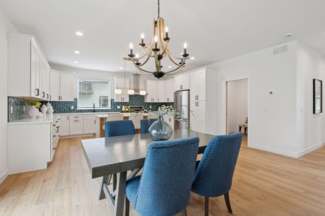 5043 42nd Ave S, Minneapolis, MN 55417 - dining area with a chandelier, light wood-style floors, and recessed lighting