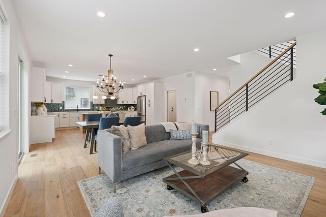 5043 42nd Ave S, Minneapolis, MN 55417 - living area featuring a chandelier, light wood finished floors, stairway, and recessed lighting