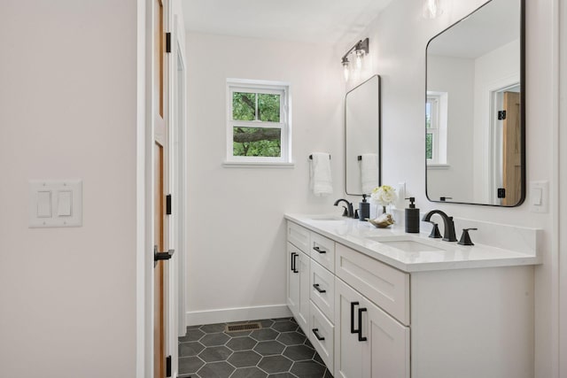 5043 42nd Ave S, Minneapolis, MN 55417 - bathroom featuring double vanity and tile patterned flooring