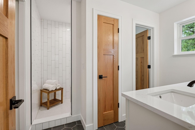 5043 42nd Ave S, Minneapolis, MN 55417 - bathroom featuring tiled shower, vanity, and tile patterned floors