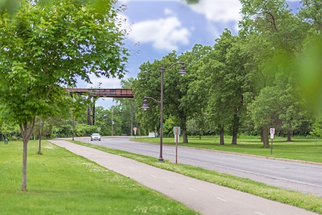 5043 42nd Ave S, Minneapolis, MN 55417 - view of home's community with a lawn and view of wooded area