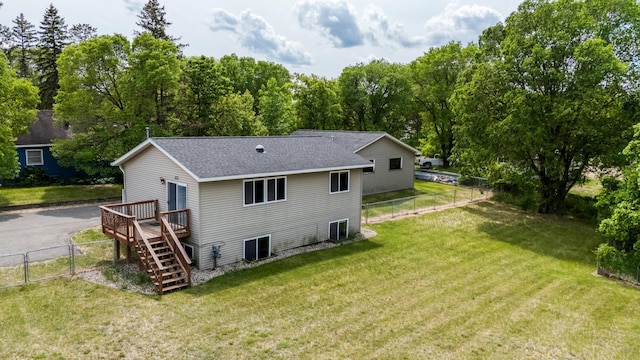 1731 Park Ave NW, Bemidji, MN 56601 - back of house featuring a fenced backyard, roof with shingles, stairs, a wooden deck, and a gate