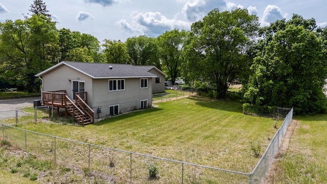 1731 Park Ave NW, Bemidji, MN 56601 - back of property featuring a fenced backyard, a wooden deck, and stairs