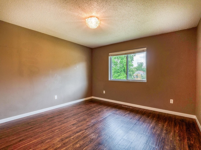 1731 Park Ave NW, Bemidji, MN 56601 - unfurnished room featuring dark wood-style floors and a textured ceiling