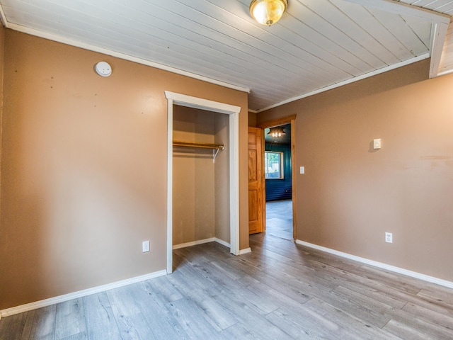 1731 Park Ave NW, Bemidji, MN 56601 - unfurnished bedroom with a closet, wood finished floors, and wooden ceiling