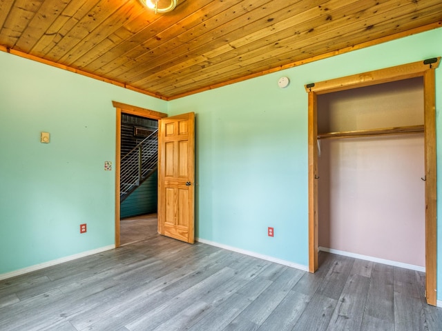1731 Park Ave NW, Bemidji, MN 56601 - unfurnished bedroom with wood finished floors, a closet, and wood ceiling
