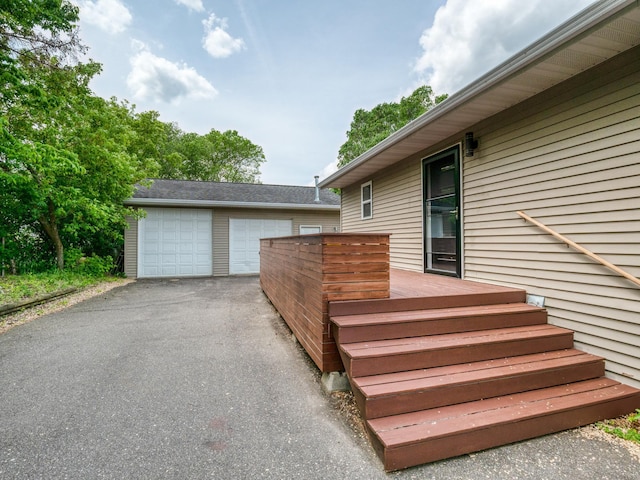 1731 Park Ave NW, Bemidji, MN 56601 - wooden terrace with a garage and an outdoor structure
