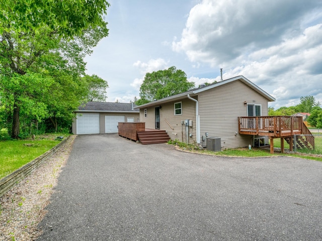 1731 Park Ave NW, Bemidji, MN 56601 - ranch-style home featuring a deck, a detached garage, an outbuilding, and stairs