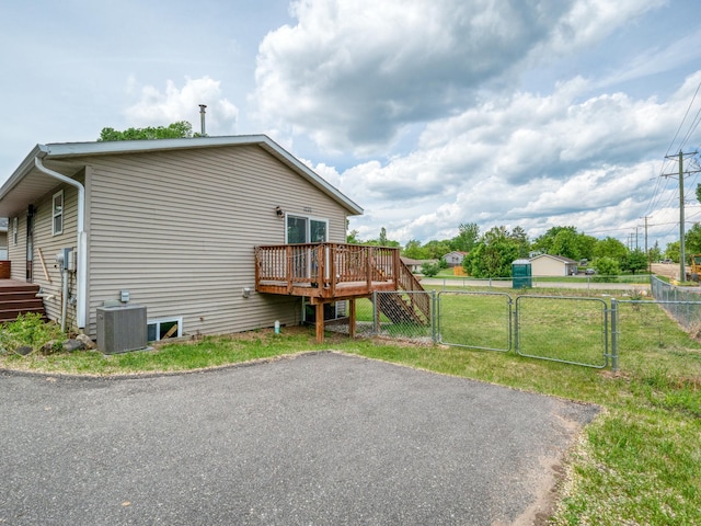 1731 Park Ave NW, Bemidji, MN 56601 - view of side of property featuring a gate and a wooden deck