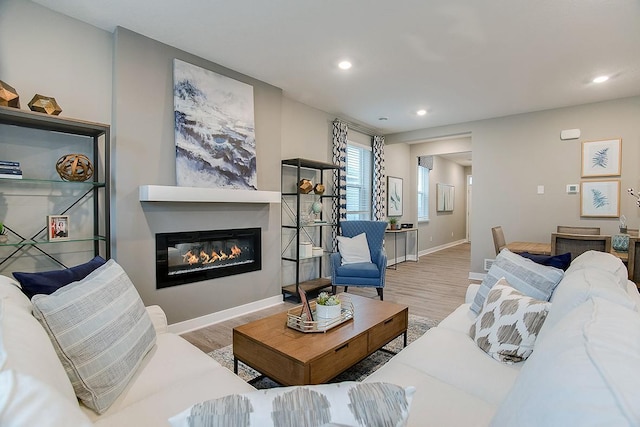 6574 208th St W, Farmington, MN 55024 - living area featuring wood finished floors, recessed lighting, and a glass covered fireplace