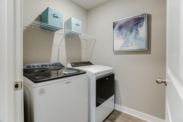 6574 208th St W, Farmington, MN 55024 - laundry room with washer and clothes dryer and wood finished floors