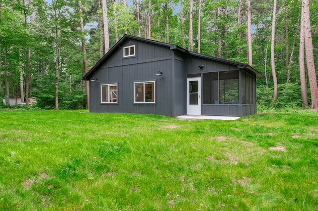 47235 184th Ave, Mcgregor, MN 55760 - view of side of property featuring a sunroom and a yard