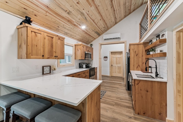 47235 184th Ave, Mcgregor, MN 55760 - kitchen with stainless steel appliances, an AC wall unit, open shelves, a peninsula, and wooden ceiling