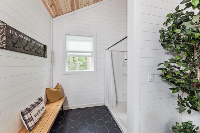 47235 184th Ave, Mcgregor, MN 55760 - bathroom with wooden walls, tile patterned flooring, wood ceiling, and lofted ceiling