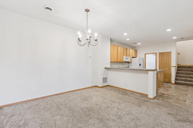 17128 Olson St NW Unit 2508, Elk River, MN 55330 - kitchen featuring white appliances, light carpet, a chandelier, a peninsula, and recessed lighting