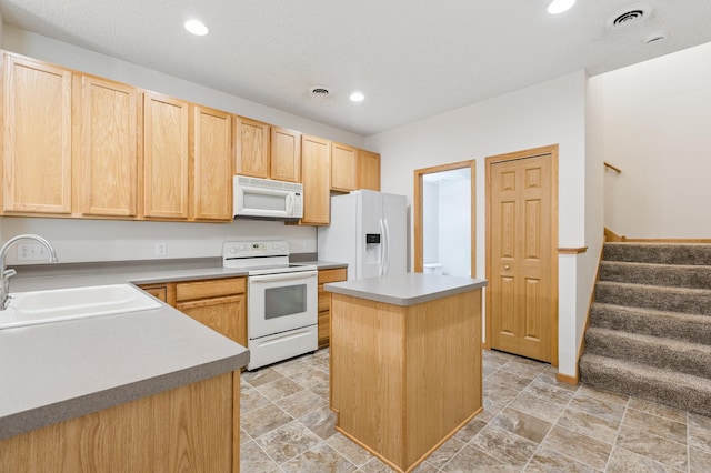 17128 Olson St NW Unit 2508, Elk River, MN 55330 - kitchen with white appliances, light brown cabinetry, recessed lighting, a center island, and light countertops