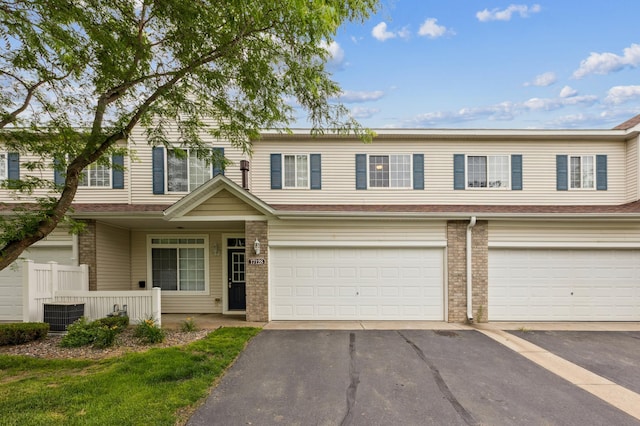 17128 Olson St NW Unit 2508, Elk River, MN 55330 - traditional home with brick siding, asphalt driveway, and an attached garage